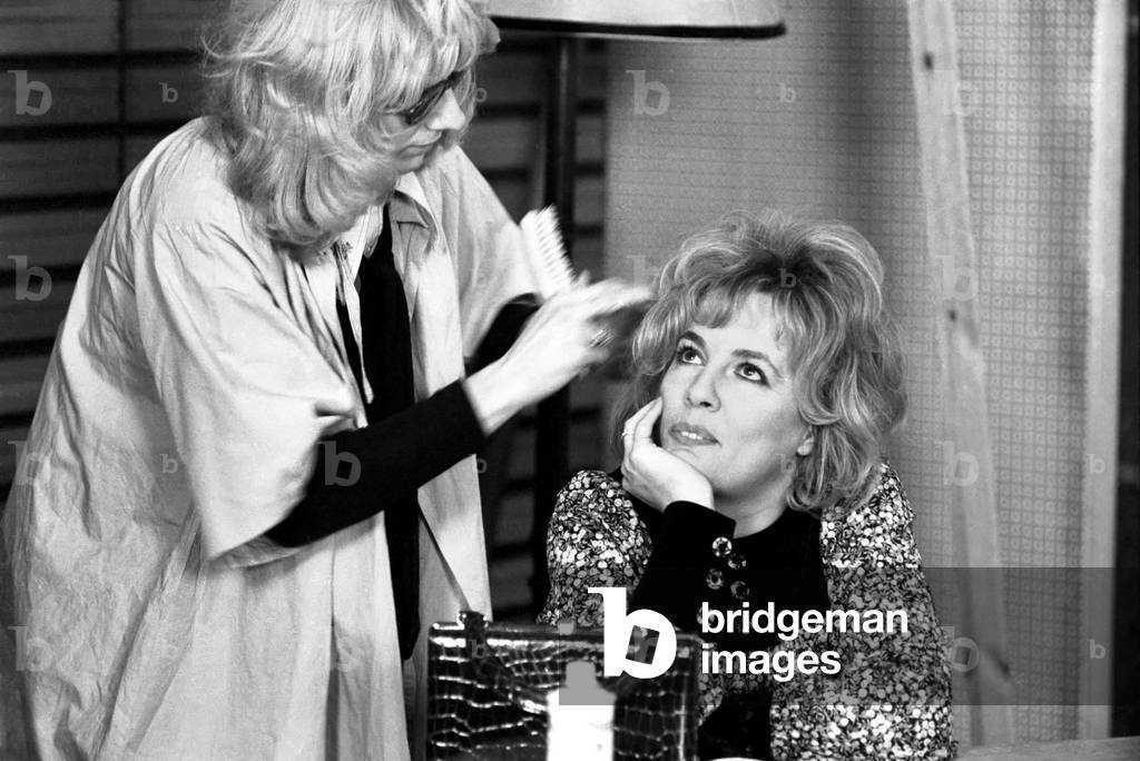 That's life. Returns to B.B.C. 1. Esther Rantzen is prepared by a make-up girl, March 1975 (b/w photo)