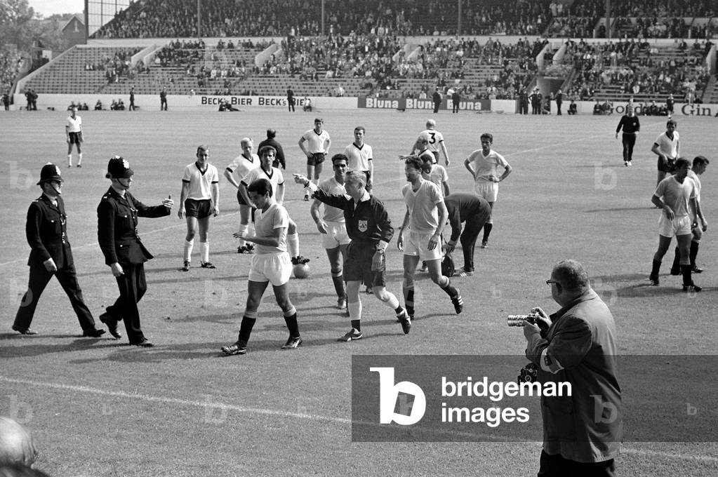 World Cup Football 1966West Germany v UruguayReferee Jim Finney calls for police assistance after Hector Silva refuses to leave the pitch after being ordered off for a foul on Germany's Helmut Haller©Mirrorpix1960s (photo)