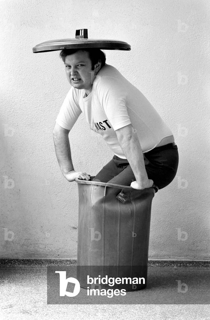 Mr. Nasty: Mr. Nasty, alias broadcaster John Forrest (25) who conducts Britain's only phone-in for children each Sunday morning on London Broadcasting. John Forrest pictured at home in his dustbin, March 1975 (b/w photo)
