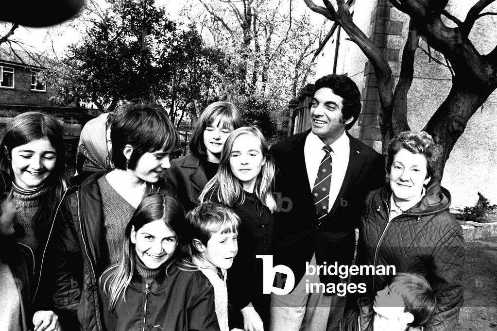 Frankie Vaughan signs autographs for fans during a visit to Ryton Park Country Club to officially launch the appeal for a new youth club in Blaydon, 1970 (b/w photo)