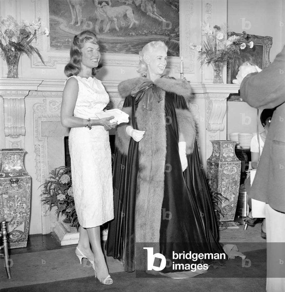 Actresses and models take part in a 18th century fashion parade at Pinewood Studios. July 1957 (b/w photo)