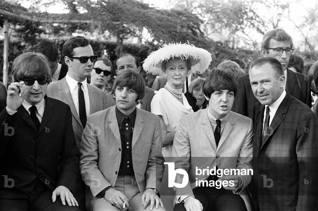 The Beatles at a Hollywood garden party on their American Tour. Left to right: John Lennon, Ringo Starr and Paul McCartney. Circa 27th August 1964 (b/w photo)