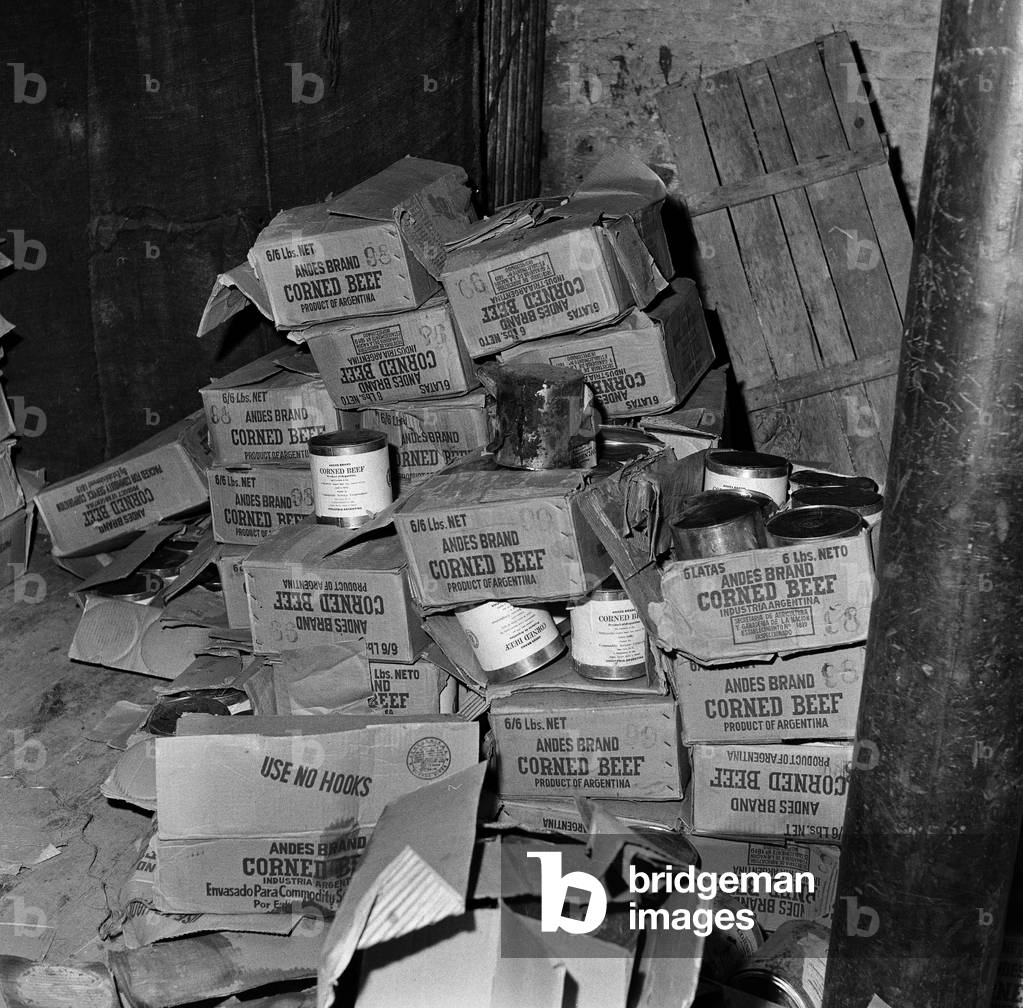 Typhoid outbreak. Aberdeen. Scotland. 1964. In 1964 there was an outbreak of typhoid in the city of Aberdeen, Scotland. The first two cases were identified on 20 May 1964; eventually over 400 cases were diagnosed and the patients were quarantined at the City Hospital in Urquhart Road, but no fatalities resulted. The outbreak was eventually traced to contaminated tinned corned beef from South America made by Fray Bentos and sold in the city's branch of the Scottish grocery chain William Low. The infected meat then contaminated a meat slicing machine within the William Low shop, leading to the spread of the disease. Pictured. Discarded Tins of corned beef from Argentina, 31st May 1964 (b/w photo)
