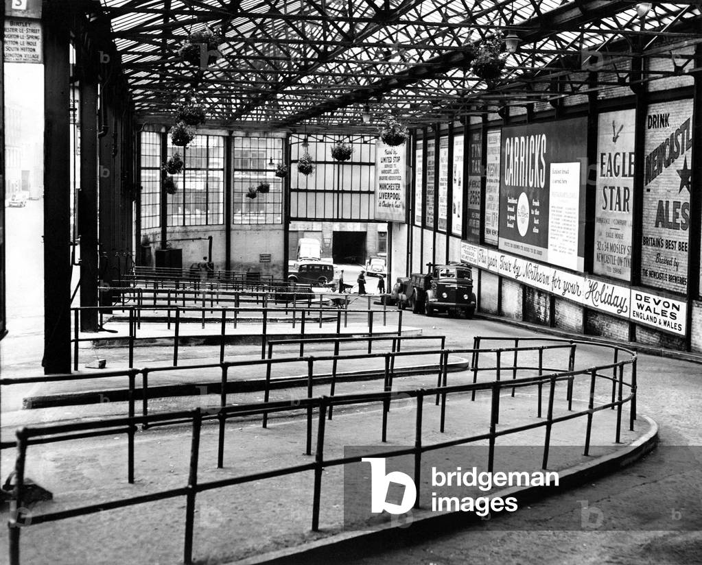Newcastle's bus stations were practically deserted on the first day of the bus strike, 20/07/1957 (b/w photo)