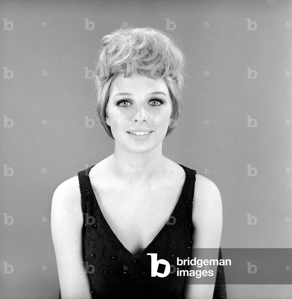 Fashion: Hair styles: Model wearing hair coil fashion item. 1966 (b/w photo)
