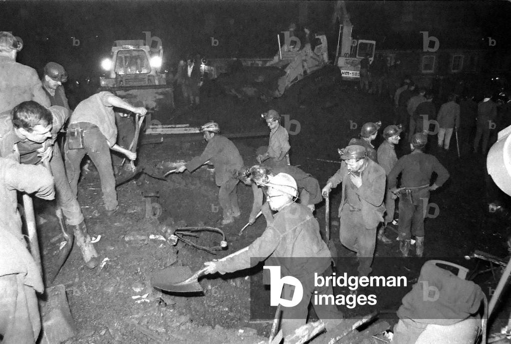 Rescue workers continue the search for victims engulfed when a slag heap collapsed at Aberfan, South Wales, 21st October 1966 (b/w photo)