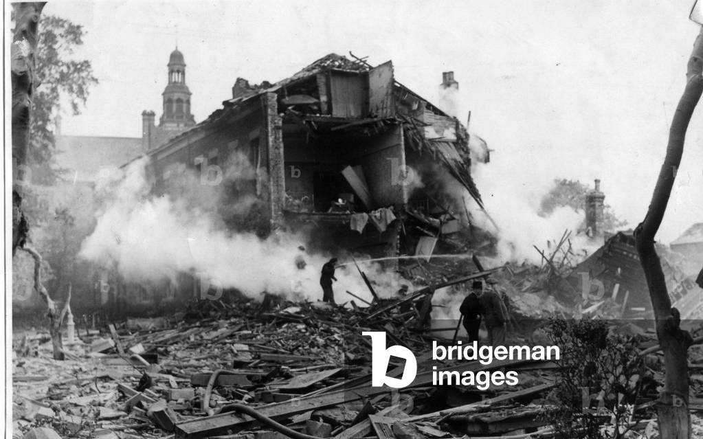 Part of a street in a residential quarter of a North East coastal town, England, demolished during a recent enemy air raid 26 May 1943