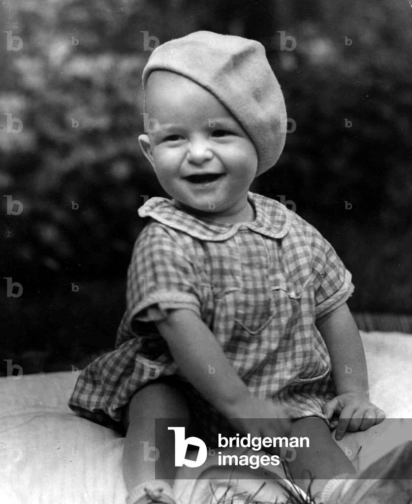 Young boy sitting in the garden. c. 1945