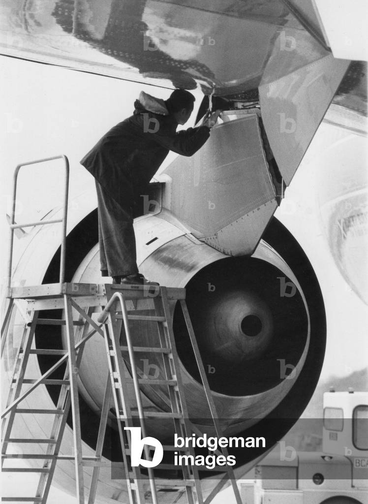 The engine of a McDonnell Douglas DC-10 airliner / aircraft being examined at Gatwick Airport. 11/06/1979 (b/w photo)