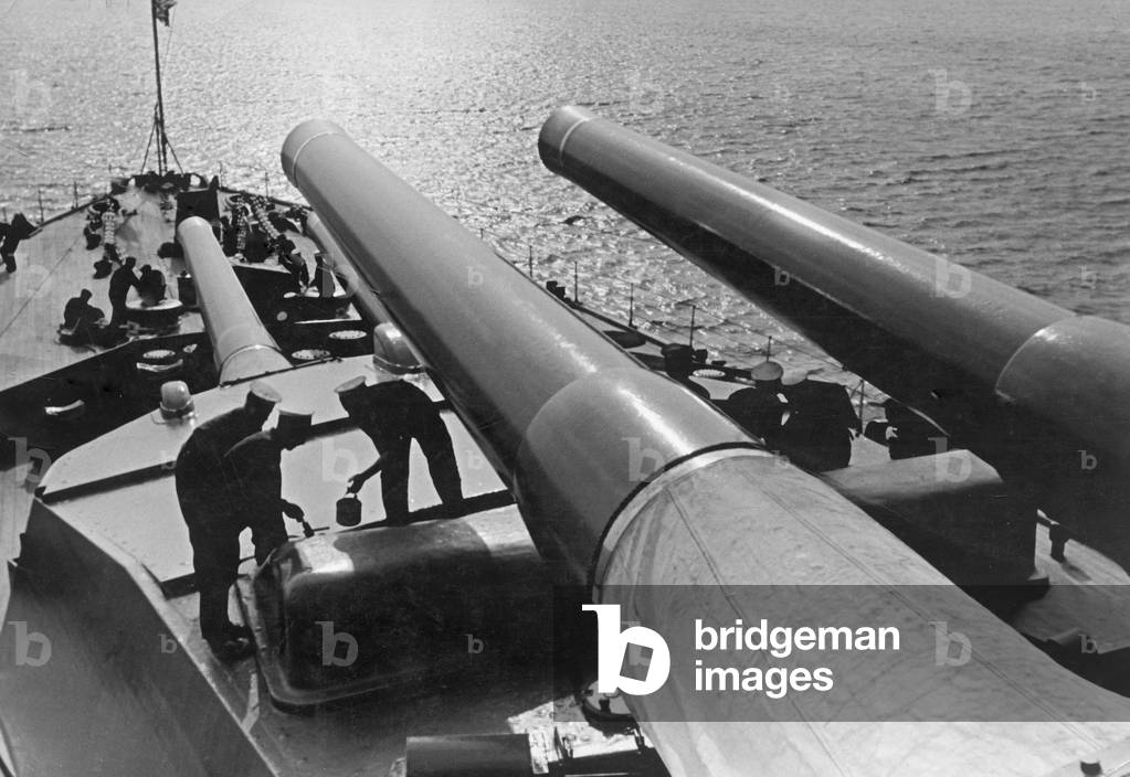 Scene on deck of the Royal Sovereign class battleship HMS Ramillies of The Royal Navy, showing her 15 inch guns prior to the Second World War
 January 1938