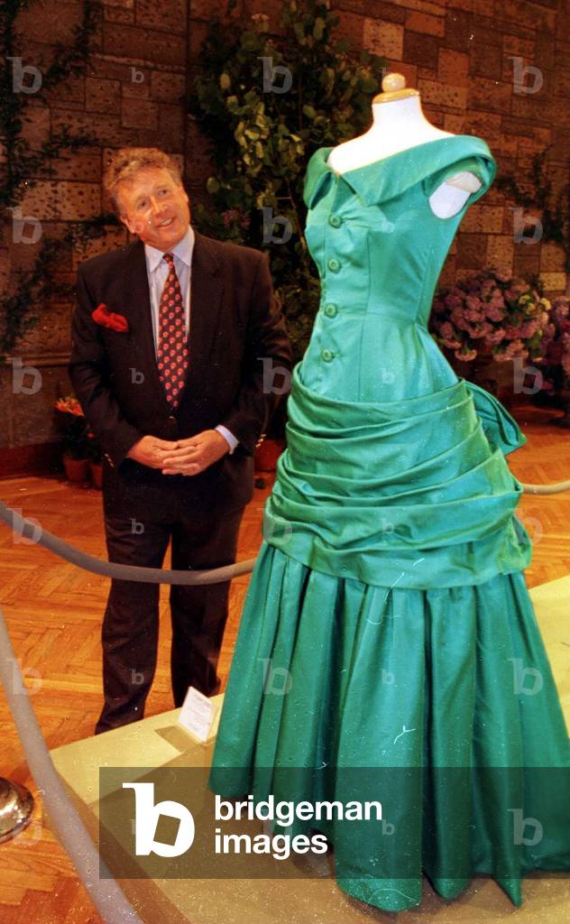 James whitaker examines Princess Diana's Dress June 1997 the dress is on display at a charity auction in New York
