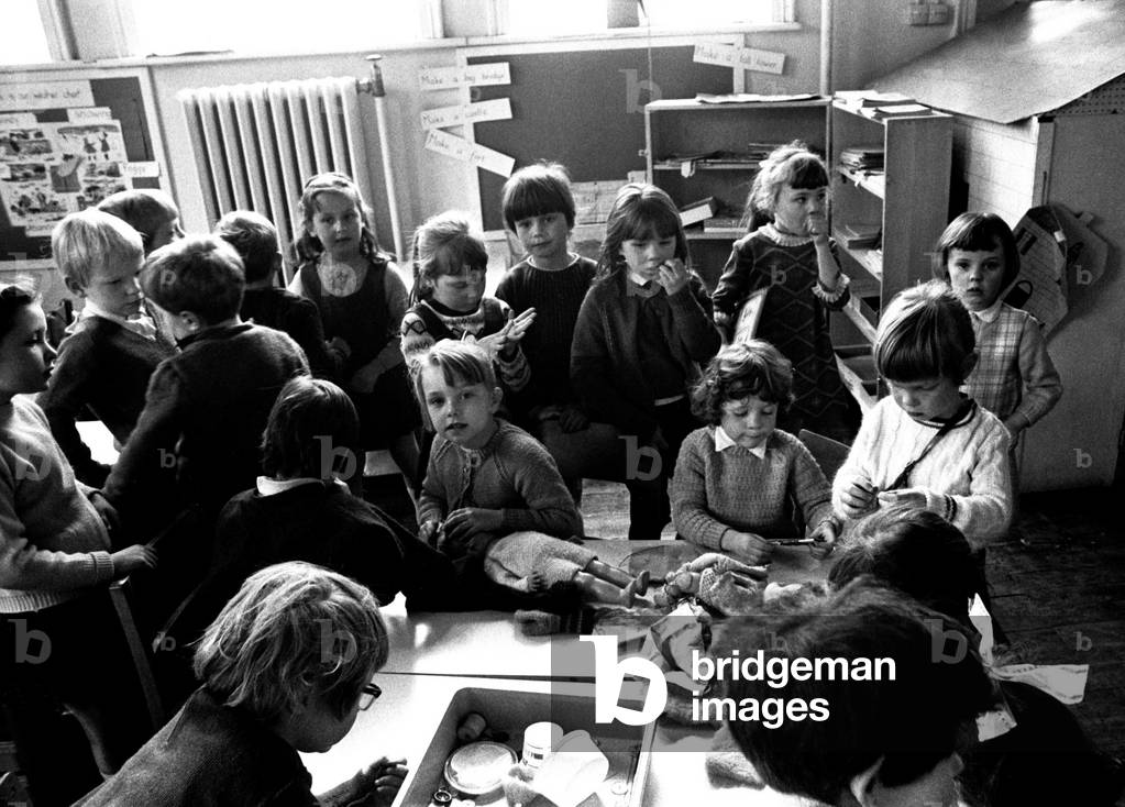 Youngsters enjoy a sewing class at Seaton Delaval First School, Tyne and Wear, 14th April 1970 (b/w photo)