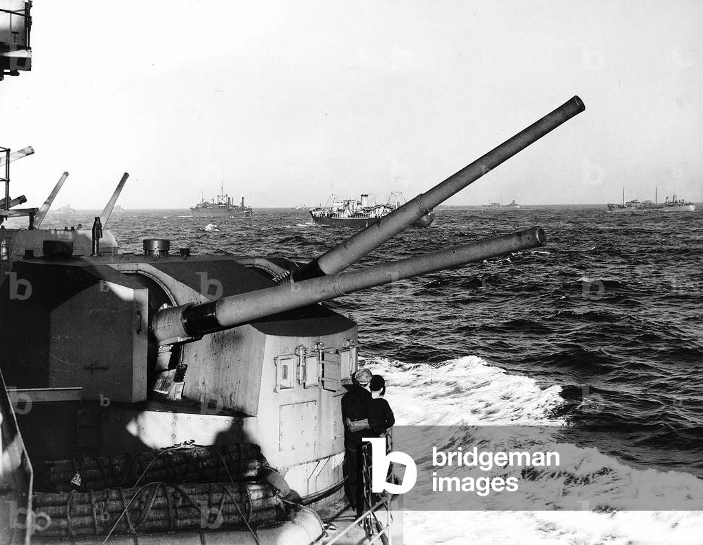 HMS Prince of Wales carrying Winston Churchill passes a WW2 supply convoy in the Atlantic. August 1941.