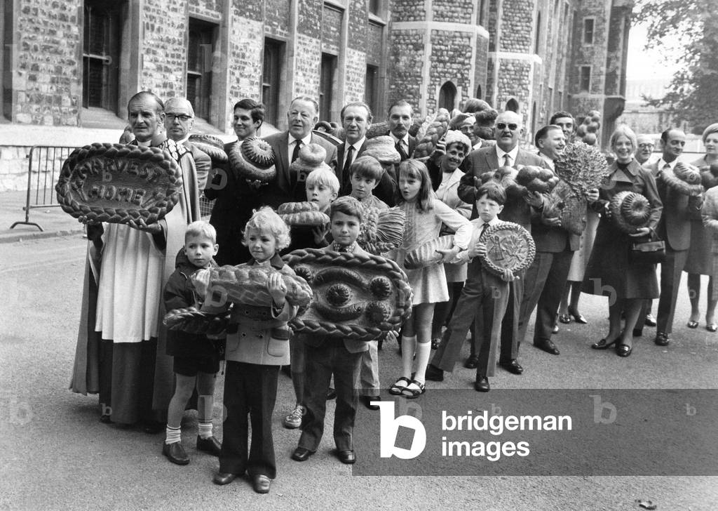 Religion Harvest Festival
Members of the National Association of Master Bakers with their wives and children gather at the Chapel of the Tower of London with the many types of bread for their annual Harvest Festival.
October 1971