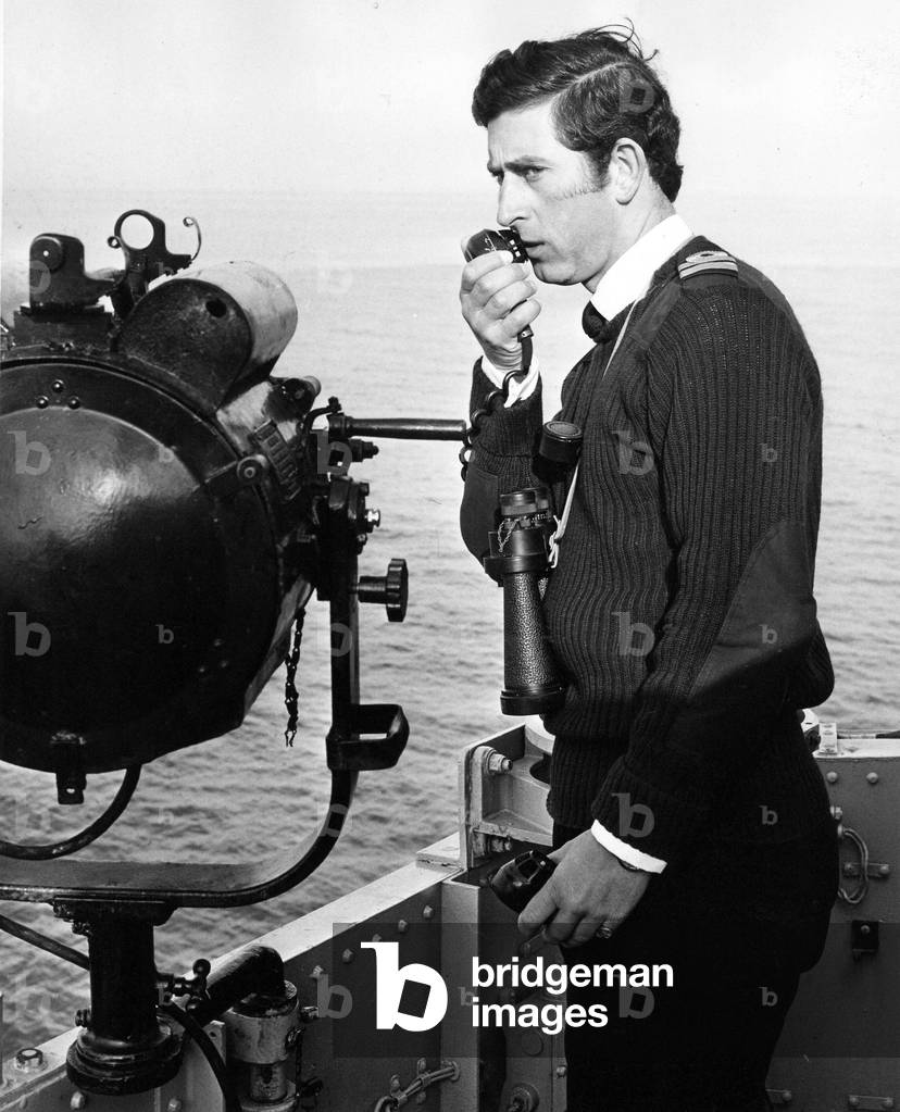 Prince Charles, The Prince of Wales on board HMS Bronington issuing orders during a voyage off the coast of Scotland, c. 01/10/1976
