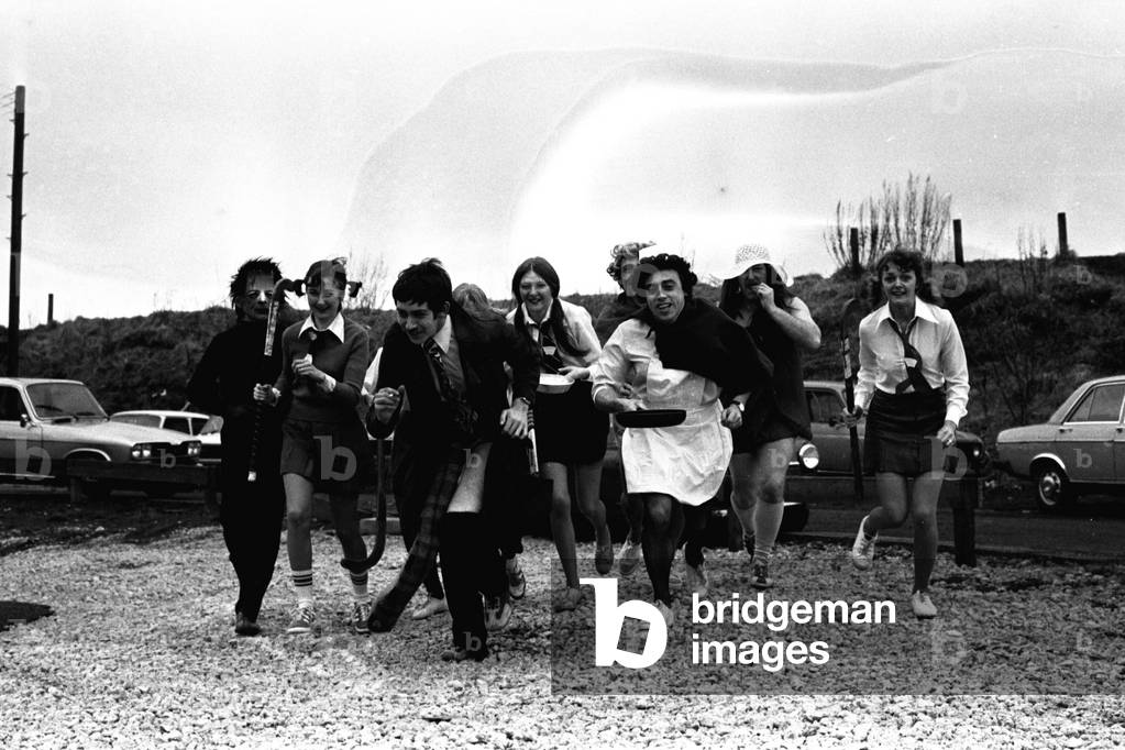 Staff from Northumbrian Water's offices at Gosforth, Newcastle. raised £113 for the Evening Chronicle cervical cancer appeal by holding a fancy dress Shrove Tuesday Pancake race 27 February 1979 (b/w photo)