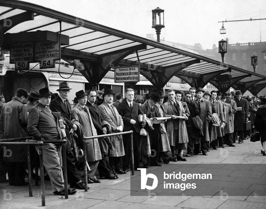 Queues at Piccadilly bus station in Manchester. October 1946