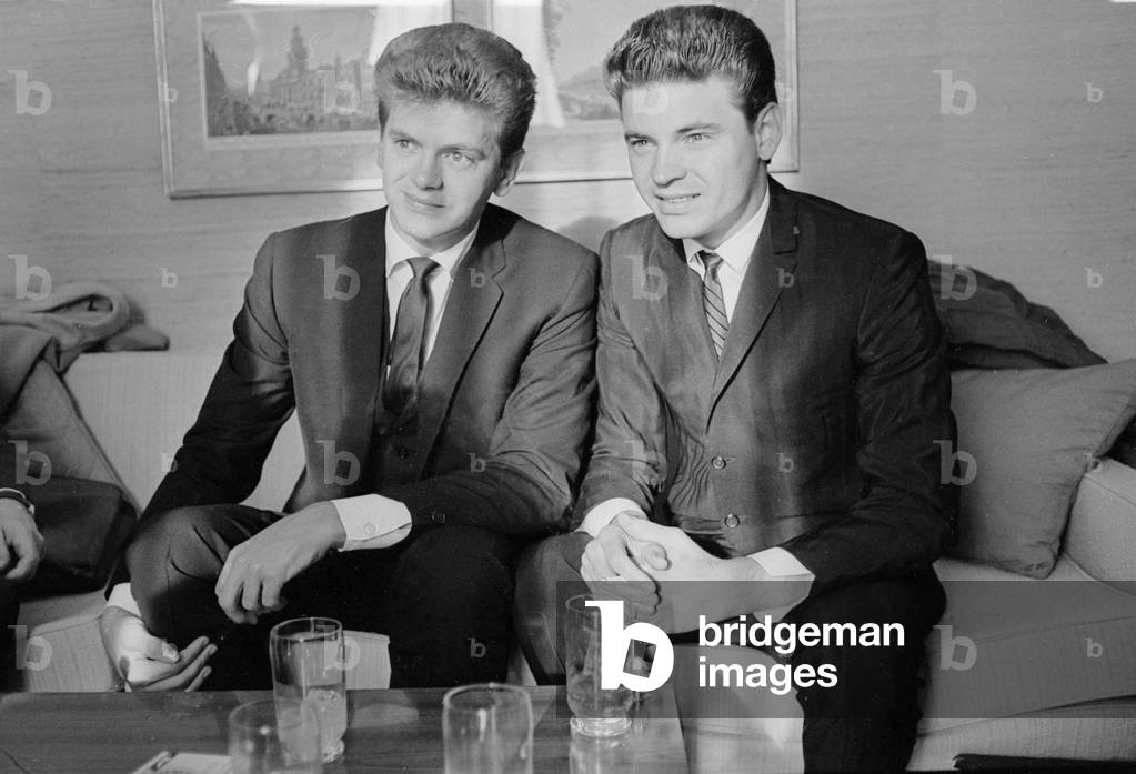 Phil (left) and Don Everly, American singing duo The Everly Brothers, pictured in their suite at the Hilton Hotel in London. 13th September 1963 (b/w photo)