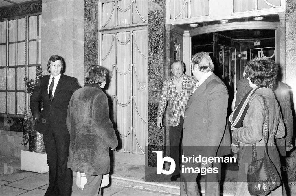 Frank Sinatra, in London for the European Leg of his farewell tour,pictured signing autographs outside Claridge's Hotel, London, 17th May 1975.