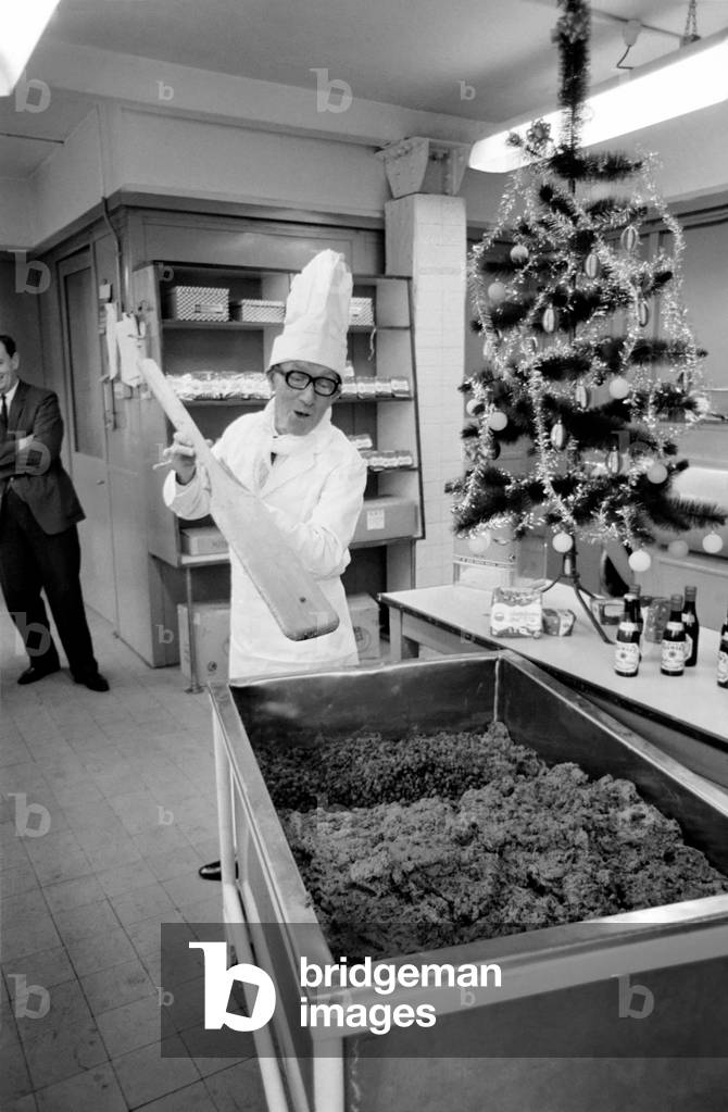 Arthur Askey, the famous little comedian stirred up a giant Christmas pudding today at a Bethnal Green (London) Bakery. When it is cooked this 160 lb pudding will be presented to the Lord mayor of London at Australia House for a charity. 
October 1969