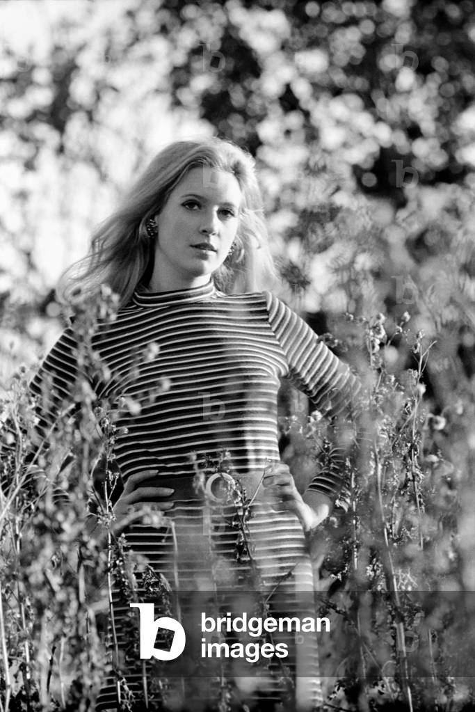 Woman taking a walk out in the countryside.