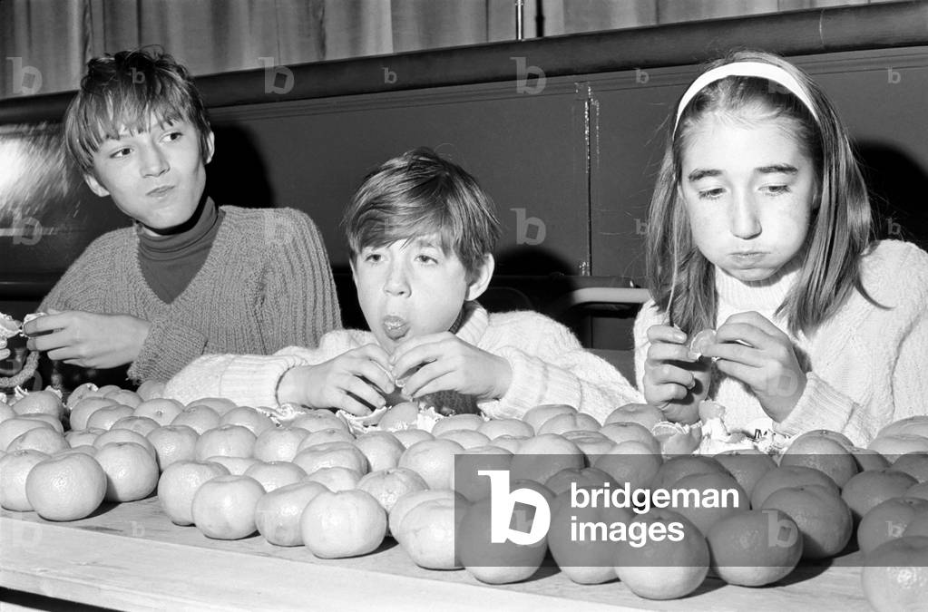 Meet Guenter Kuhn the 14 years old world champion orange eater, who today (Sat) made sure of his title when he devoured 19 oranges in 2 minutes then went on to eat 34 (repeat 34) more just to show that he was a real champ. Participates take part in the orange eating competition. November 1969