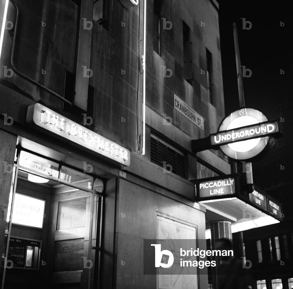 The Brewmaster pub and Leicester Square tube station on the corner of Cranbourn Street. 22nd September 1961 (b/w photo)