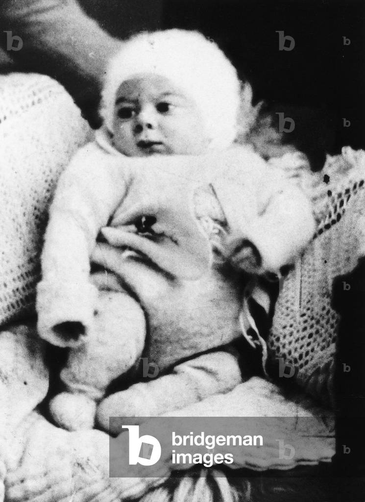 Ronnie Kray as baby convicted murderer and gangland boss during his first year. Mother Violet paid to have the photograph taked at an East End photo studio and sent copies to relatives, 24th October 1933 (b/w photo)