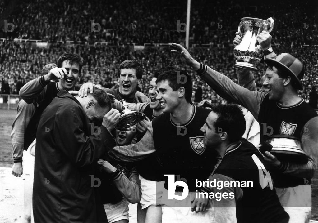 West Ham United mob their manager Ron Greenwood after they had won the FA Cup in 1964 at Wembley (photo)
