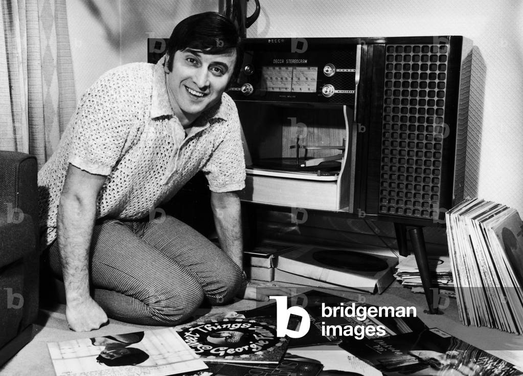 Singer Vince Hill seen here looking through his record collection at home. 3rd March 1967