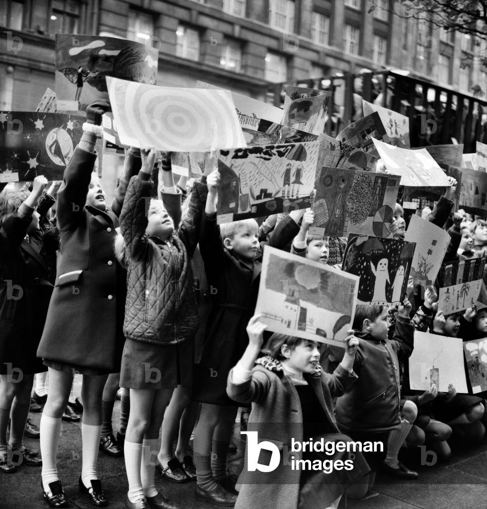 Children from The Glebe Primary School, Sussex Road, invited to illustrate 16 different categories of weather ranging from foggy nights to sunny days. At Thames Television Studio's. Children of The Glebe Primary School arriving at Television House, Kingsway brandishing their weather paintings. November 1969