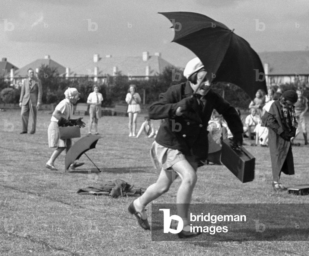 The umbrella race during a schools sports day in Kingston Upon Thames. Circa 1936