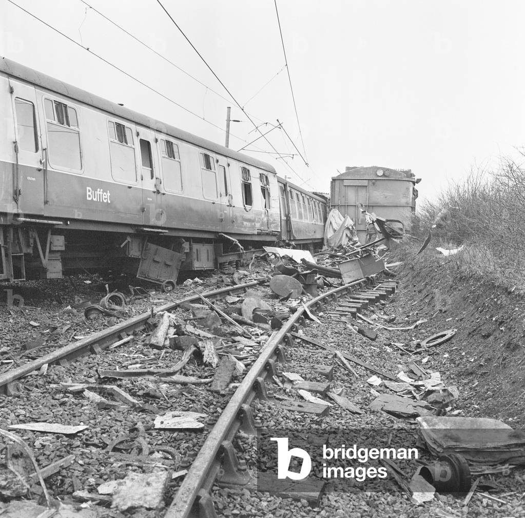 The Hixon rail crash occurred on 6 January 1968 when a low-loader transporter carrying a 150 ton electrical transformer was struck by the 11.30 Intercity Manchester to Euston express train on a recently installed automatic level crossing at Hixon, Staffordshire, England., 1968 (b/w photo)