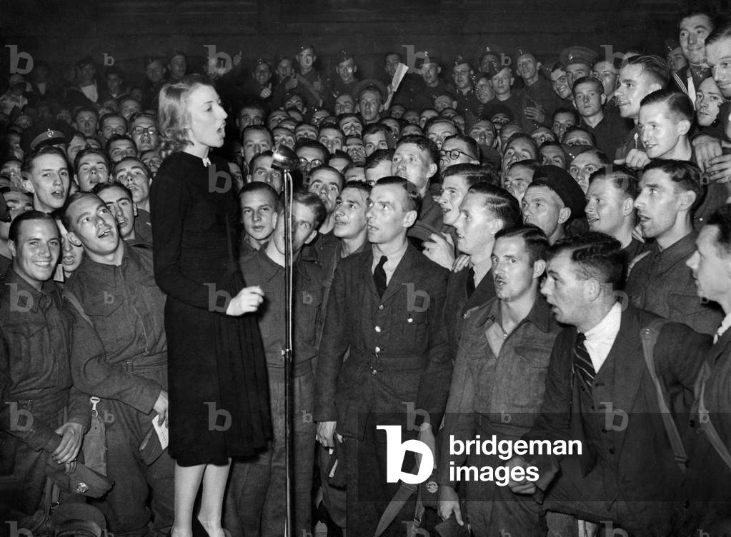 The Services sweetheart Vera Lynn shown here entertaining them at a concert. 
September 1940