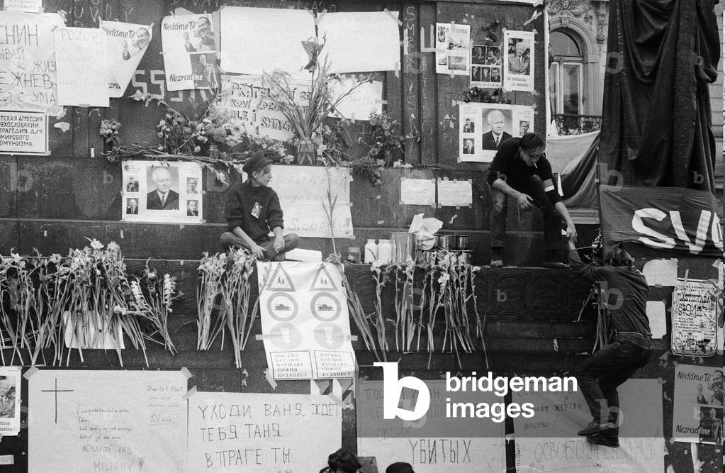 Prague, Czechoslovakia. The Prague Spring, a period of political liberalization in Czechoslovakia during the era of its domination by the Soviet Union after World War II. Young people clear posters from King Wenseslas statue. August 1968 (b/w photo)