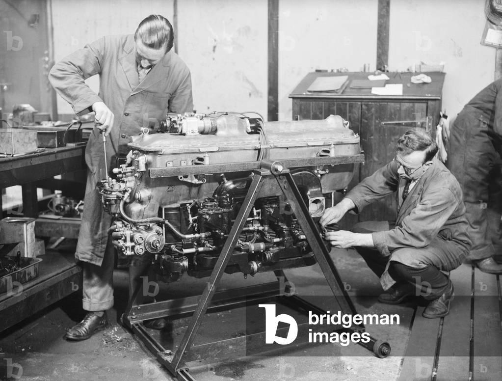 Engineer check the Gipsy Six engine during the construction of the Miles 3 Falcon aircraft at the Philips and Powis factory at Woodley Aerodrome, Reading 2nd April 1934 (b/w photo)