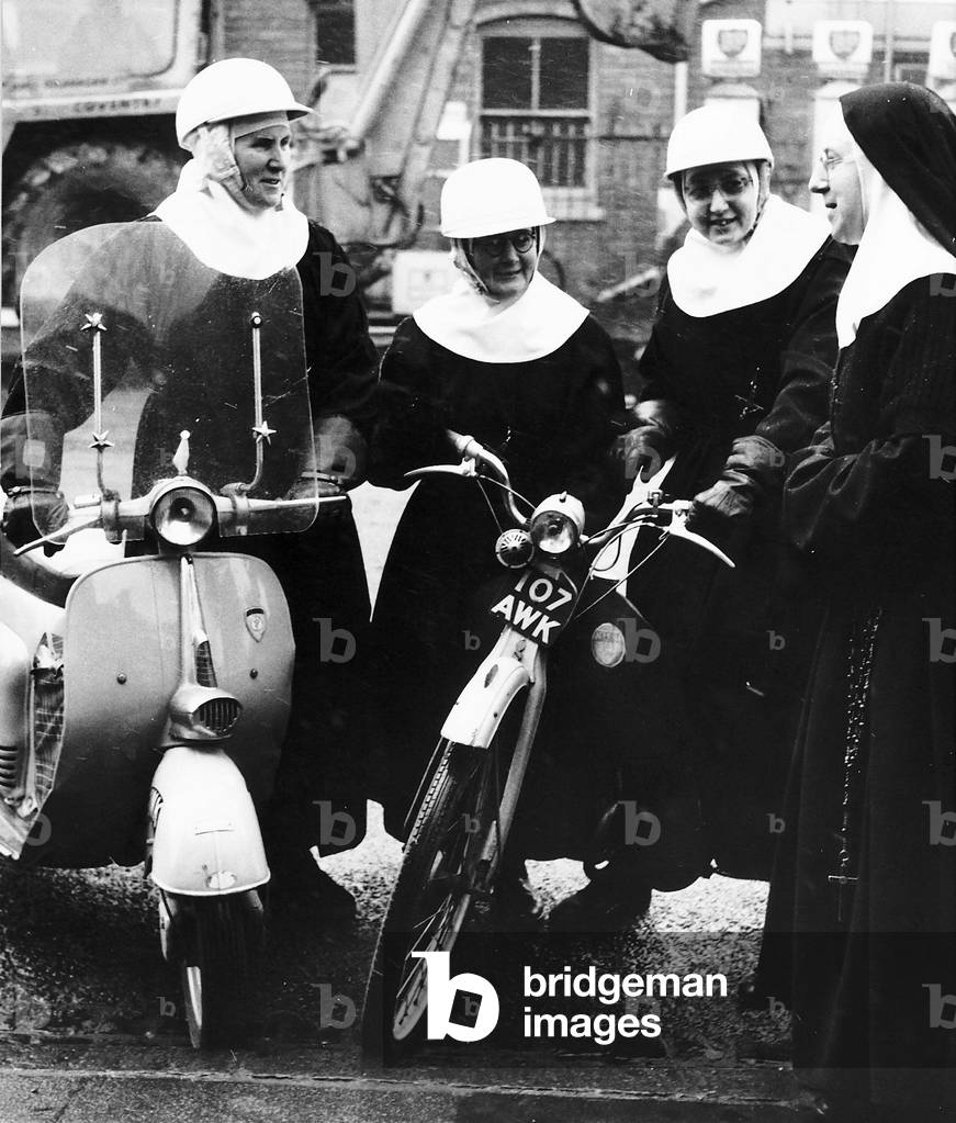 Mother Superior Blanche right with sisters left to right Edmund, Anne and Cecilia bidding farewell to the nuns about to go on their missions in Foleshill, Coventry, 24/02/1964 (b/w photo)