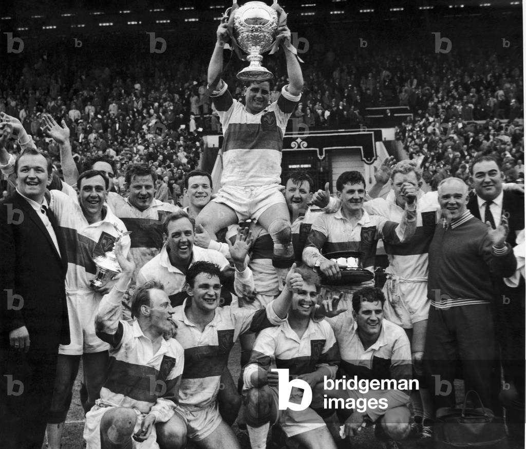 Rocky Turner the Wakefield Trinity captain is chaired with the trophy after his team won the Rugby League Cup by beating Huddersfield 12 - 6 at Wembley. 12th May 1962