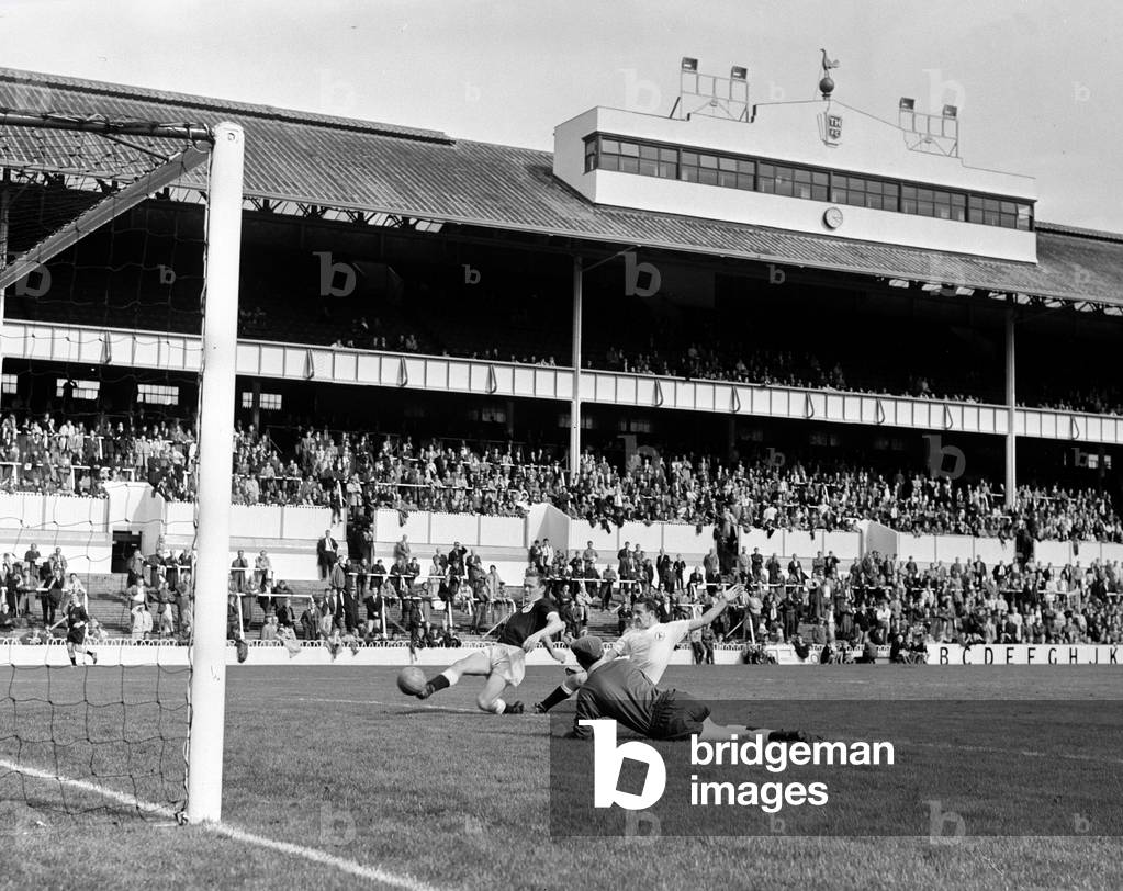 Tottenham Hotspur in action during a trial match at White Hart LaneLes Allen scores challenged by Dave Mackay August 1963 (photo)