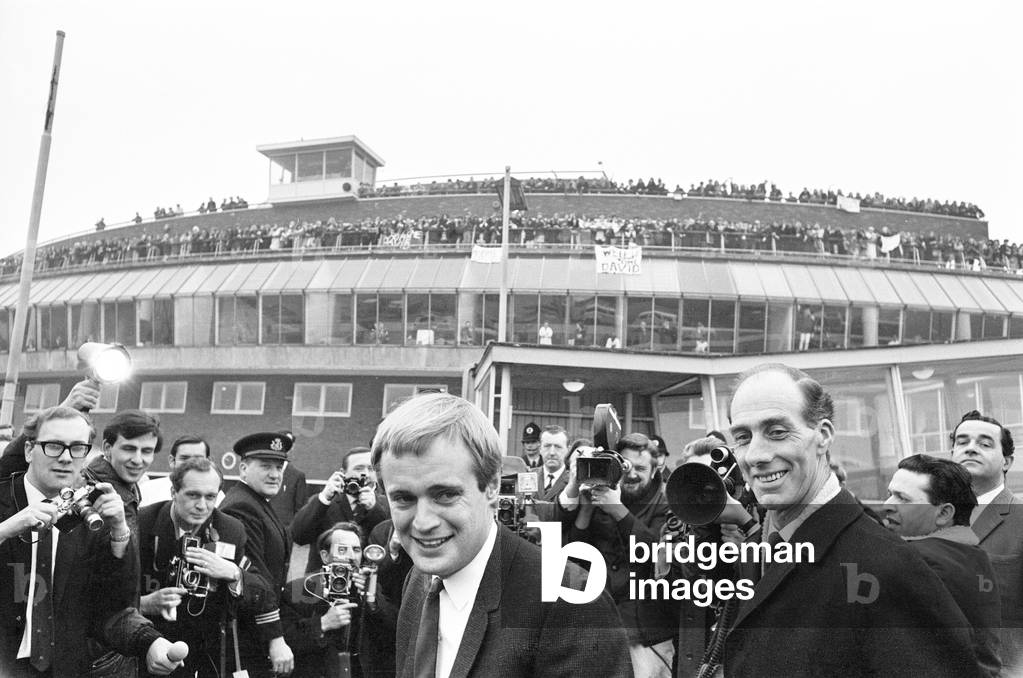 David McCallum, actor who plays the role of secret agent Illya Kuryakin in NBC show The Man from U.N.C.L.E., pictured arriving at London Heathrow Airport, 16th March 1966 (b/w photo)