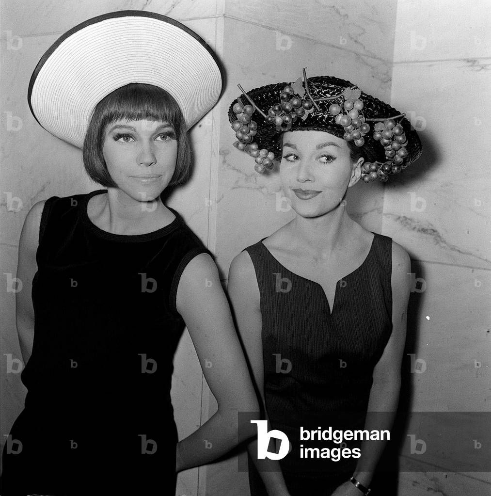 These models are wearing the latest trend in millinery fashion, 1962 (b/w photo)