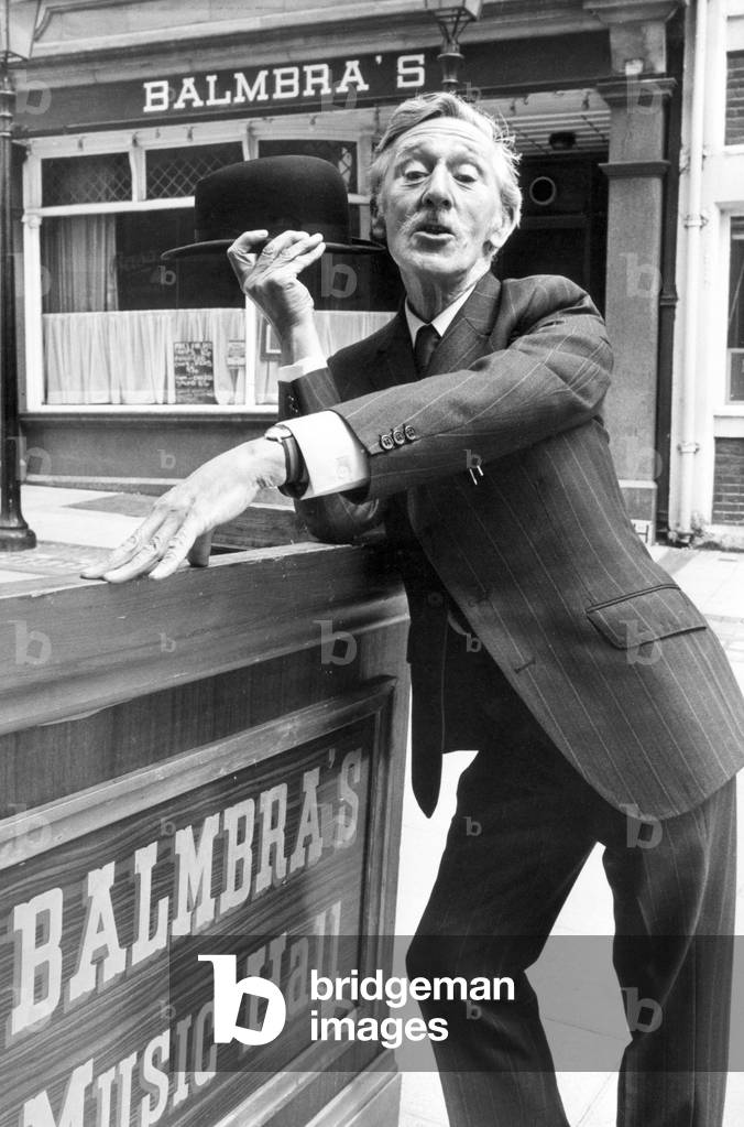 Frankie Burns, Tyneside Comedian. Standing outside Balmbra's Music Hall, in the centre of Newcastle, 16th June 1980 (b/w photo)