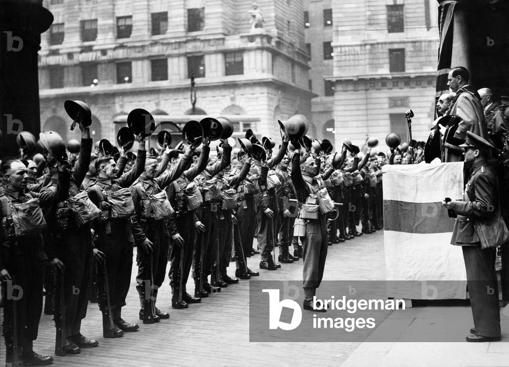 The first City of London Pioneer Corps give three cheers to Sir William George Coxen the Lord Mayor of London after his address to them, May 1940 (b/w photo)