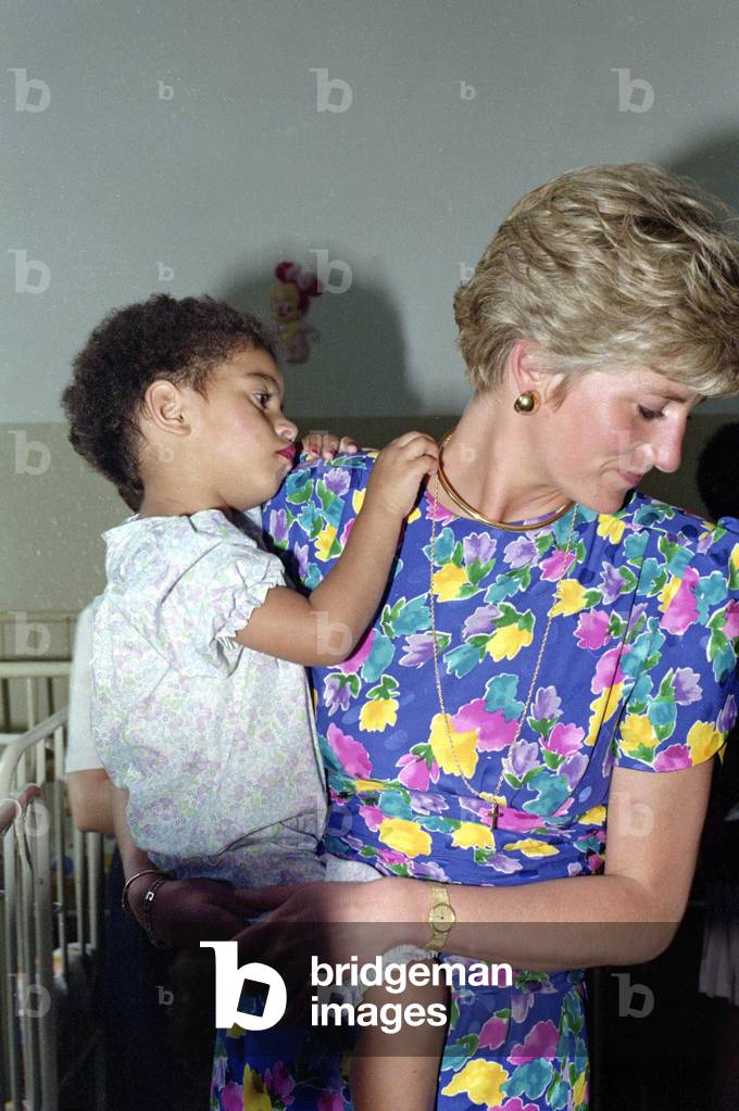 Princess Diana of Wales cuddling a baby with AIDS in Brazil 
April 1991