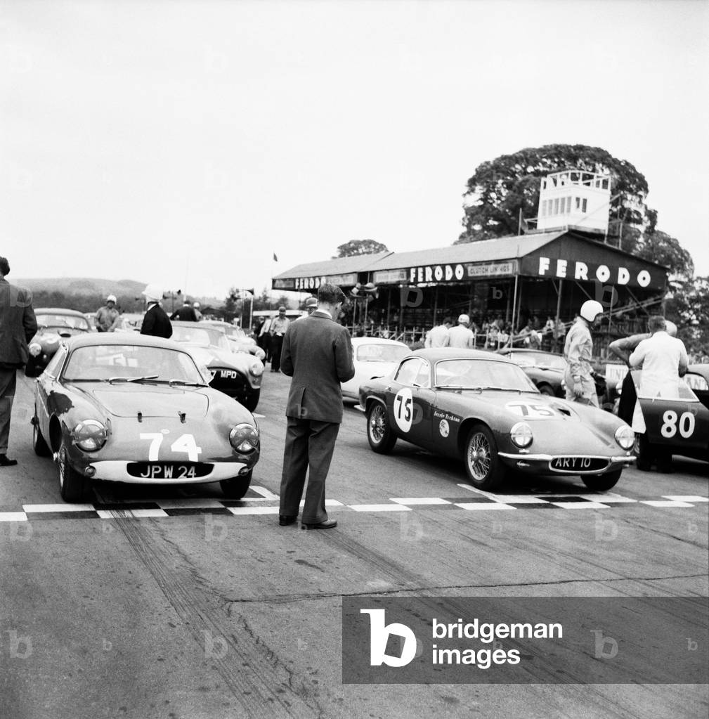 Motor car racing at Goodwood. Cars on the starting grid before the race. Chichester, West Sussex. June 1960 (b/w photo)