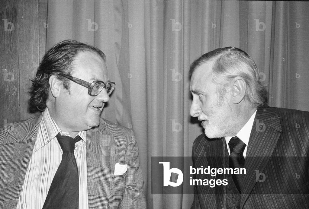 A verbal confrontation between John Mortimer and Spike Milligan over dinner at Kettners, Romilly Street, London, June 20th 1978 (b/w photo)