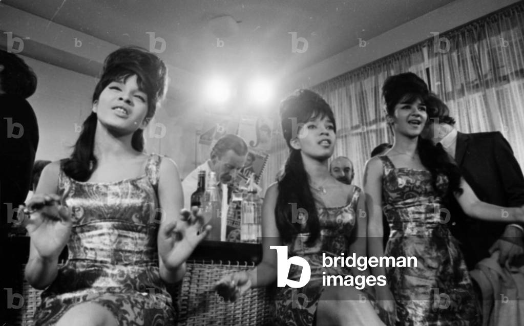 Pop Group 'The Ronettes' performing in London. Ronnie Bennett (l) Nedra Talley (centre) and Estelle Bennett (r) 16th January 1964 (b/w photo)