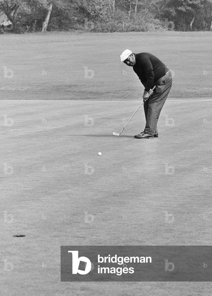 Variety Club of Great Britain Pro-Am Gold Tournament at Moor Allerton Golf Club in Leeds.South African golfer Sewsunker Sewgolum putting at the fifth green, 13th May 1970 (b/w photo)
