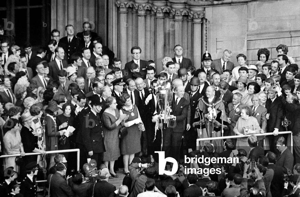 Manchester United Football Team return after winning the European Cup - Matt Busby outside town hall with the trophyJune 1968 (photo)