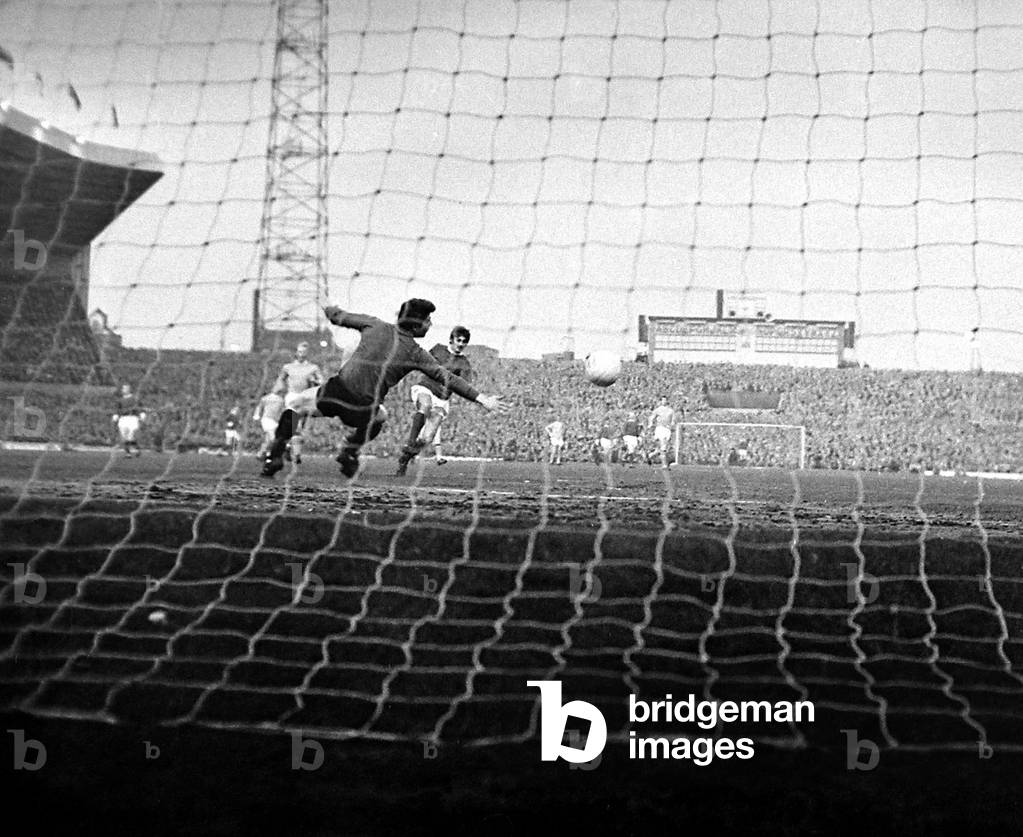 Manchester United star George Best scores past Manchester City goalkeeper Ken Mulhearn after only 38 seconds of their match at Old Trafford March 1968Final score: Man Utd 1-3 Man City (photo)